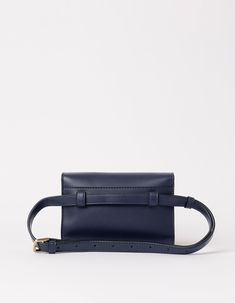 Sanne Vogel x O My Bag Born from a shared love for bags and a passion for sustainability, actress and writer Sanne Vogel and O My Bag designed the Sanne Belt Bag. Keys? Cards? Phone? Check! This belt bag's got space for all your essentials, leaving your hands free to take on the day. The navy colorway adds a touch of class to any outfit. This bag is our first bag designed to be worn on the waist, and our first style that is available exclusively in Vegan Uppeal. Do you want to wear your Sanne cr Rectangular Belt Bag With Adjustable Strap For Daily Use, Everyday Belt Bag With Detachable Strap Clutch, Everyday Clutch Belt Bag With Detachable Strap, Chic Pouch Belt Bag For Daily Use, Daily Use Satchel Belt Bag With Removable Pouch, Luxury Top Handle Belt Bag For Everyday Use, Daily Use Belt Bag With Removable Pouch, Chic Belt Bag With Removable Pouch For Daily Use, Chic Satchel Belt Bag For Everyday Use