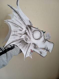 a paper cut out of a dragon head