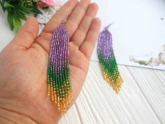 Mardi gras earrings dangle, Long statement earrings, festival beaded earrings, Women shining earrings purple green gold, mardi gras gift Looking for something to complement the festival image? Consider these earrings. -Created in the colors of the festival -Goodly combined not only with the appropriate suit but also for everyday images. -Made of quality Czech beads. -I can be a wonderful gift for the holiday. -Gift packaging and personalized postcard are available. -You can add a silver hook if Bohemian Jewelry For Mardi Gras Party, Purple Jewelry For Mardi Gras, Bohemian Mardi Gras Party Jewelry, Green Beaded Dangling Earrings For Party, Green Beaded Jewelry For Mardi Gras, Green Jewelry For Mardi Gras Party, Purple Dangling Beads Earrings For Party, Handmade Purple Chandelier Earrings For Party, Purple Beaded Chandelier Earrings For Party