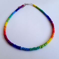 Colorful Rainbow Seed Beads Necklace This is a dainty beaded necklace, made with 9 different colors of pretty glass seed beads. It is on a beading wire and it has and extender for additional length. Let me know if you have any questions :) Happy shopping!! Rainbow Necklaces With Tiny Round Beads, Rainbow Necklace With Tiny Round Beads, Adjustable Rainbow Beaded Necklace, Rainbow Round Beaded Necklaces With Tiny Beads, Multicolor Heart Beaded Necklaces With Round Beads, Rainbow Beaded Necklaces For Jewelry Making, Rainbow Heishi Beads Necklace With Spacer Beads, Rainbow Heishi Beads Necklace With Colorful Beads, Rainbow Necklaces With Heart-shaped Beads