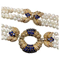 An absolutely spectacular Italian made necklace done in 18K yellow gold and strung together with 5.95mm cultured pearls. All sections of this necklace are adorned with F-G color Vs1-2 clarity round and baguette diamonds having a total approximate weight of 8.40cttw. Let’s not forget about the stunning royal blue round cut sapphires both in the centerpiece as well as the clasp. All sapphires are natural and have an approximate weight of 11.70cttw. Striking would be an understatement. By Italian m Luxury Sapphire Necklaces With Gemstone Beads, Exquisite Sapphire Necklace, Luxury Sapphire Necklace With Polished Finish, Luxury Sapphire Necklace With Faceted Beads, Luxury Exquisite Sapphire Necklace, Italian Necklace, Sabyasachi Jewellery, Jewel Necklace, Baguette Diamonds