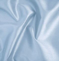 a close up view of a light blue fabric