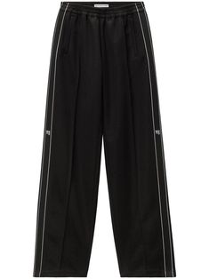 black elasticated waistband side stripe detailing rear patch pocket two side slit pockets logo print to the side floor-length Clothing Tape, Black Tape, Track Pant, Fantasy Gowns, Airport Fashion, Clothing Logo, Mens Fall, Side Stripe, Sport Pants