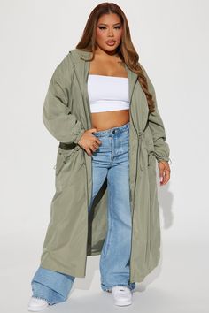 Available In Black And Olive. Trench Hooded Long Sleeve Windbreaker Cinched Waist Toggle Detail Fully Lined Shell 100% Polyester Lining 100% Polyester Imported | Ride My Wave Trench Windbreaker Jacket in Sage size 1X by Fashion Nova Oversized Hooded Outerwear With Drawstring, Fall Outerwear With Drawstring For Outdoor Activities, Khaki Drawstring Outerwear For Outdoor, Drawstring Outerwear For Fall Outdoor Activities, Trendy Hooded Windbreaker For Cold Weather, Hooded Khaki Outerwear With Drawstring, Khaki Hooded Outerwear With Drawstring, Khaki Winter Outerwear With Drawstring, Winter Khaki Outerwear With Drawstring