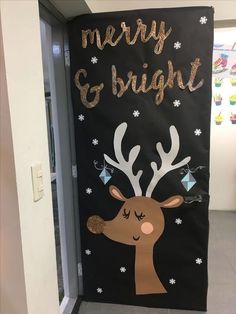 a christmas door decoration with reindeer and merry and bright written in gold on the front