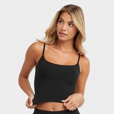 YOUR NEW CAMI GO-TO Fresh. Modern. Confident. You are going to love the versatility of this cami. The Seamless Smoothing Cropped Cami provides the extra boost you need with body-hugging styles. Seamless and lightweight, this women’s bodywear cami is crafted from a single-layer fabric for light smoothing. A built-in shelf bra offers support while the modern cropped length has a ribbed hem that lightly embraces your midsection. Perfect for layering, this versatile cropped cami features adjustable Black Seamless Tank Top For Yoga, Black Seamless Tops For Yoga, Black Seamless Yoga Top, Black Seamless Medium Support Tank Top, Seamless Cami Top For Workout, Black Spaghetti Strap Crop Top For Workout, Black Seamless Camisole With Tank Straps, Black Spaghetti Strap Camisole For Workout, Black Tank Top With Medium Support And Seamless Design