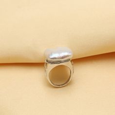 Item Type: Ring Gender: Women Material: Pearl, Silver Style: Romantic Size: Resizable Package Includes: 1 x Pc