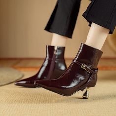 Elevate your fall fashion with our Autumn Chic Cow Leather Heeled Ankle Boots. Made from genuine cow leather, these boots are not only stylish but also built to last. The pointed toe shape and round heel type add a touch of sophistication to any outfit, while the 6.5cm high heel provides a flattering lift. With a versatile ankle height, these boots can be effortlessly paired with jeans, dresses, or skirts. Experience maximum comfort and warmth with the plush insole material. Upgrade your shoe game this season with our Autumn Chic Cow Leather Heeled Ankle Boots. Leather Shoes For Women, Burgundy Boots Ankle, Autumn Chic, Women Boots, Heel Type, Casual Everyday, Heeled Ankle Boots, Heel Shoes, Shoe Game