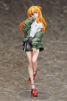 a woman with orange hair is walking in the water wearing short shorts and a green jacket