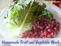 lettuce, grapes, and broccoli on a plate with water droplets