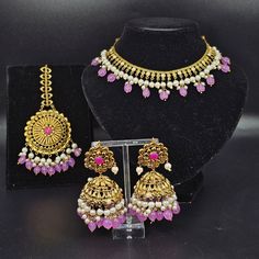 Indulge in opulence with our premium Farhaa Choker Necklace Set, gold-plated and beaded for the discerning connoisseur. This exquisite ensemble seamlessly blends traditional elegance with contemporary allure, ensuring a timeless and regal adornment. Elevate your style with the sophistication of this masterpiece, a testament to refined taste and luxury. This Choker necklace comes with Beautiful Jhumki earrings and mangteeka. Earrings drop length is 8cm width 4cm approx. Mangteeka width is 5cm. Elegant Pink Jewelry Sets For Diwali, Gold Kundan Necklace With Elegant Design For Formal Events, Gold Kundan Necklace With Elegant Design For Formal Occasions, Elegant Tilla Jewelry Sets For Festive Occasions, Classic Gold Jewelry Sets For Celebration, Gold Plated Round Beads Jewelry For Formal Occasions, Gold Plated Round Beads Jewelry For Formal Events, Gold Plated Jewelry With Round Beads For Formal Occasions, Elegant Gold Plated Necklace With Tilla