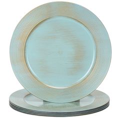 a set of four dinner plates with gold rims on each plate and two black stripes around the edge