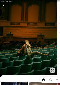 an image of a woman sitting in a theater