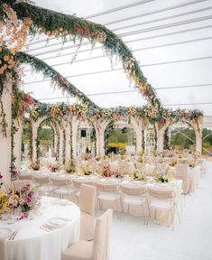 an outdoor wedding venue with tables and chairs