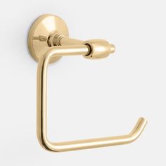 a gold toilet paper holder on a white wall with the lid open and handle extended