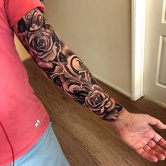 a man with a rose tattoo on his arm