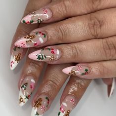 These almond-shaped nails showcase gingerbread men, holly, and candy canes for a cozy Christmas-inspired design. The soft pink and white base adds a subtle background for the holiday elements. This simple yet festive look is perfect for a winter manicure with a playful touch. Ginger Bread Pink Nails, Winter Nails Gingerbread, Xmas Nails Gingerbread Man, Amazing Christmas Nails, Long Christmas Nail Ideas, Christmas Manicure Nails, Snowman French Tip Nails, Holiday Nails Gingerbread, Acrylic Almond Christmas Nails