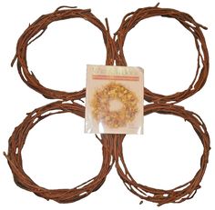 four brown wreaths with yellow flowers on them