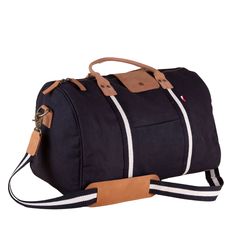 This duffle is a perfect size to bring as a carry-one or in addition to your other bags. There's a handy trolly slip on the back so it slips easily over your rollie-bag handles. With a full leather bottom and details, this bag will add some style back to your travels! Matching travel kits also available. (The Natural bag has black /natural striped webbing). This item can also be monogrammed!Product Overview: Dimensions: 18" x 10" x 10" with a 6" handle drop, 55" adjustable / detachable strap Hea Everyday Rectangular Duffle Bag With Leather Trim, Modern Leather Trim Duffle Bag For Overnight Trips, Travel Weekender Bag With Coated Canvas Handles, Modern Duffle Bag With Leather Handles For Overnight Trips, Leather Handled Tote Luggage For Overnight Trips, Overnight Trips Tote Luggage With Leather Handles, Classic Duffle Bag With Handles For Daily Use, Functional Bags With Leather Handles For Overnight Trips, On-the-go Duffle Bag With Double Handle