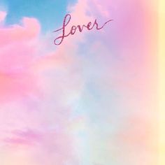 the word love written in cursive writing on a pastel colored sky background