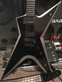 an electric guitar sitting on top of a table