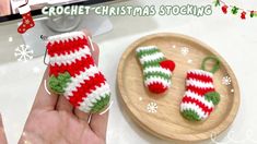 crochet christmas stockings ornament being held by someone