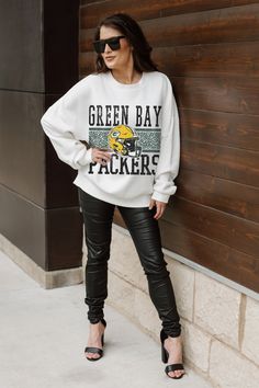 Stand out from the crowd in our Green Bay Packers premium fleece long sleeve sweatshirt. Boasting an oversized fit, crewneck and ribbed knit neckline, wrists, and waistband, it effortlessly blends comfort with fashion. Show your support for your favorite school or team in this irresistibly soft sweatshirt.