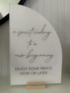 a sign that says, a sweet ending to a new beginning enjoy some treats now or later