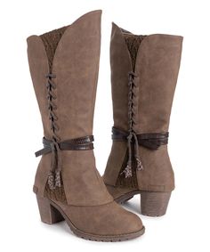 Brown Lacy Luca Boot - Women. Tall boot with lacing that holds together the structure for a rugged look. Stepped-up blocky heel and a split-V cuff.3'' heel9.5'' shaftPull-onMan-made upperFaux fur liningMemory Foam InsoleTPR soleImported Muk Luks Boots, Lace Up Block Heel, High End Shoes, Cute Shoes Heels, Slouched Boots, Zipper Boots, Black Boots Women, Sweater Boots, Winter Boots Women