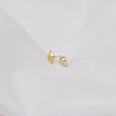 * These SOLID GOLD earrings are made entirely from 14K solid gold * Jewelry is packaged and shipped in a delicate jewelry gift box. * If you are purchasing it as a gift, please feel free to add a personal note. * We have upgrade shipping service with FedEx, TNT,DHl,it will take about 5~8days to deliver, please make sure leave us your phone number for upgrade shipping.  ❤  Features * Gold Kt: 14K solid gold * Available Gold Color: Yellow Gold * Guaranteed Authentic 14k Gold, Not Plated Or Filled * Dimension: 5.5mm * 3mm * Post thickness: 0.8mm * Stamp: 14K ❤  Material: High quality and durability --Gold Info: * Entirely 14K solid gold ❤  If you would love my designs, here is the link for more designs. www.skcjewelrydesign.com www.etsy.com/shop/skcjewelryDesign ❤  If you have any additional Conch Stud, Rhombus Shape, Minimalist Earrings Gold, Diamond Shape Earrings, Solid Gold Earrings, Delicate Jewelry, Modern Earrings, Gold Studs, Gold Earrings Studs