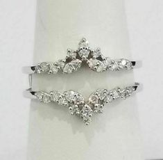 two white gold rings with diamonds on them