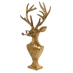 a gold colored deer head with antlers on it