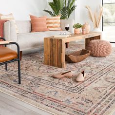 a living room filled with furniture and decor on top of a rug covered in lots of dirt