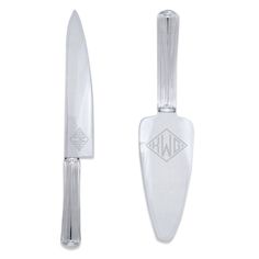 a glass knife with an engraved logo on the blade is shown in front of a white background