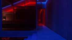 an empty room with red and blue lighting