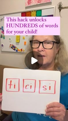 a woman holding up a sign with words on it that read, this hack unlocks hundreds of words for your child