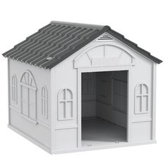 a white toy house with windows and a roof