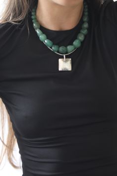 This vintage necklace is a one-of-a-kind piece made of 925 sterling silver with a 16-inch beaded chain.  The pendant/locket type is a charming green aventurine/jade mix, which is a natural gemstone, stones are IMPERFECT means they are REAL and not Lab Made, which makes the necklace unique and beautiful.  The closure is a hook, and the necklace is signed. The main stone color is green, and the shape is round. The style is beaded with a retro (1935-1950) era and a charm theme.  Handmade in the United States, this necklace is perfect for jewelry collectors and lovers of unique pieces Both Jade and Green Aventurine are stones of luck and fortune. Their energy opens us up to success and abundance, with both stones having been used for years for this amazing ability. please message me with any q Jade Bead Necklace, Pendant Locket, Necklace Unique, Jade Beads, Jewelry Inspo, Green Aventurine, Unique Necklaces, Beaded Chain, Sterling Silber