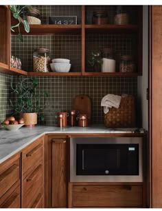 a kitchen with wooden cabinets and tile backsplash