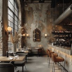 the interior of a restaurant with tables and chairs