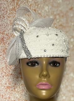 Simple, yet elegant. White lace Fascinator half hat trimmed with pearls, rhinestones, and bow. The hat is affixed to the head via a hatstring. The hat's circumference measures approximately 22.5 inches. (hat size 22.5 inches) PLEASE NOTE All items for Free Shipping will be shipped via USPS First Class Mail. Elegant Hat With Satin Bow For Party, Elegant Wedding Hats With Satin Bow, Elegant Party Hat With Satin Bow, Wedding Fascinator With Satin Bow, Wedding Fascinator With Fitted Satin Bow, Elegant Costume Hats For Ceremonies, Elegant Church Headband Headpiece, Elegant Bead Cap Headband, White Gatsby Style Fascinator For Evening