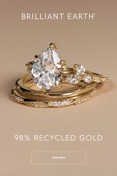 three gold rings with diamonds on them and the text brilliant earth 98 % recycled gold