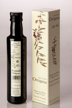 a bottle of extra virgin olive oil next to a box