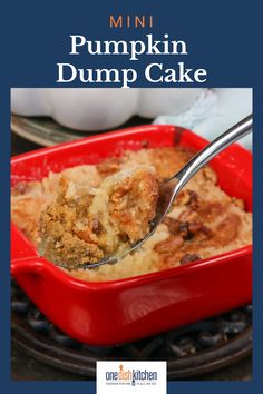 a red casserole dish filled with pumpkin dump cake