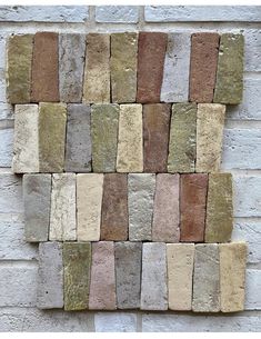 a brick wall with different colored bricks on it