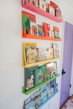 colorful bookshelves on the wall in a child's room