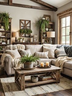 a living room filled with lots of furniture and plants on top of a coffee table