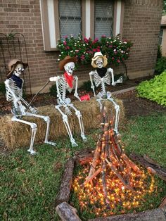 three skeletons sitting on hay bales in front of a house with words that say just thinking about halloween gives me a bone