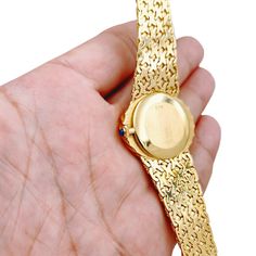 Ladies Corum 26mm x 30mm Oval Vintage 18K Yellow Gold Watch with Gold Dial and Weave Bezel. Pre-Owned SN# 163**** Brand: Corum. Dial Color: Gold. Type: Wristwatch. Gender: Women's. Condition: Excellent. Bezel: 18K Yellow Gold. Total Weight: 62 Grams. Case Size: 26mm x 30mm. Movement: Quartz (Battery). Band Material: 18K Yellow Gold. Bezel Material: 18K Yellow Gold. Bracelet Size: Fits 6.5" to 6.75" Wrist. Warranty: One (1) Year Limited Service Warranty. Luxury Gold Oval Watch, Luxury Oval Gold Watches, Gold Oval Watches As Gifts, Gold Oval Watches For Gift, Oval Gold Watches For Gifts, Oval Quartz Watch For Formal Occasions, Yellow Gold Oval Watch For Gift, Oval Diamond Watch For Formal Occasions, Oval Yellow Gold Watch As Gift