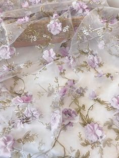 the fabric has pink flowers on it